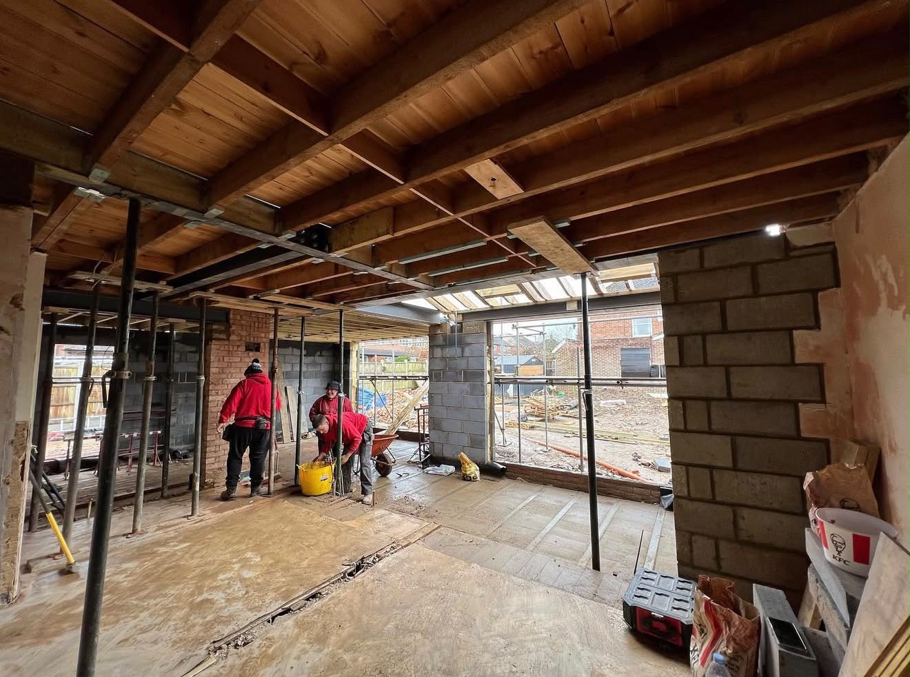 Open-plan rear extension during first fix with structural steels and floor joists