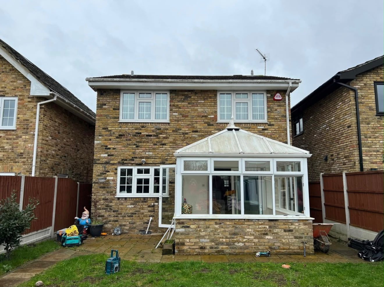 Existing rear of property with original conservatory prior to extension works