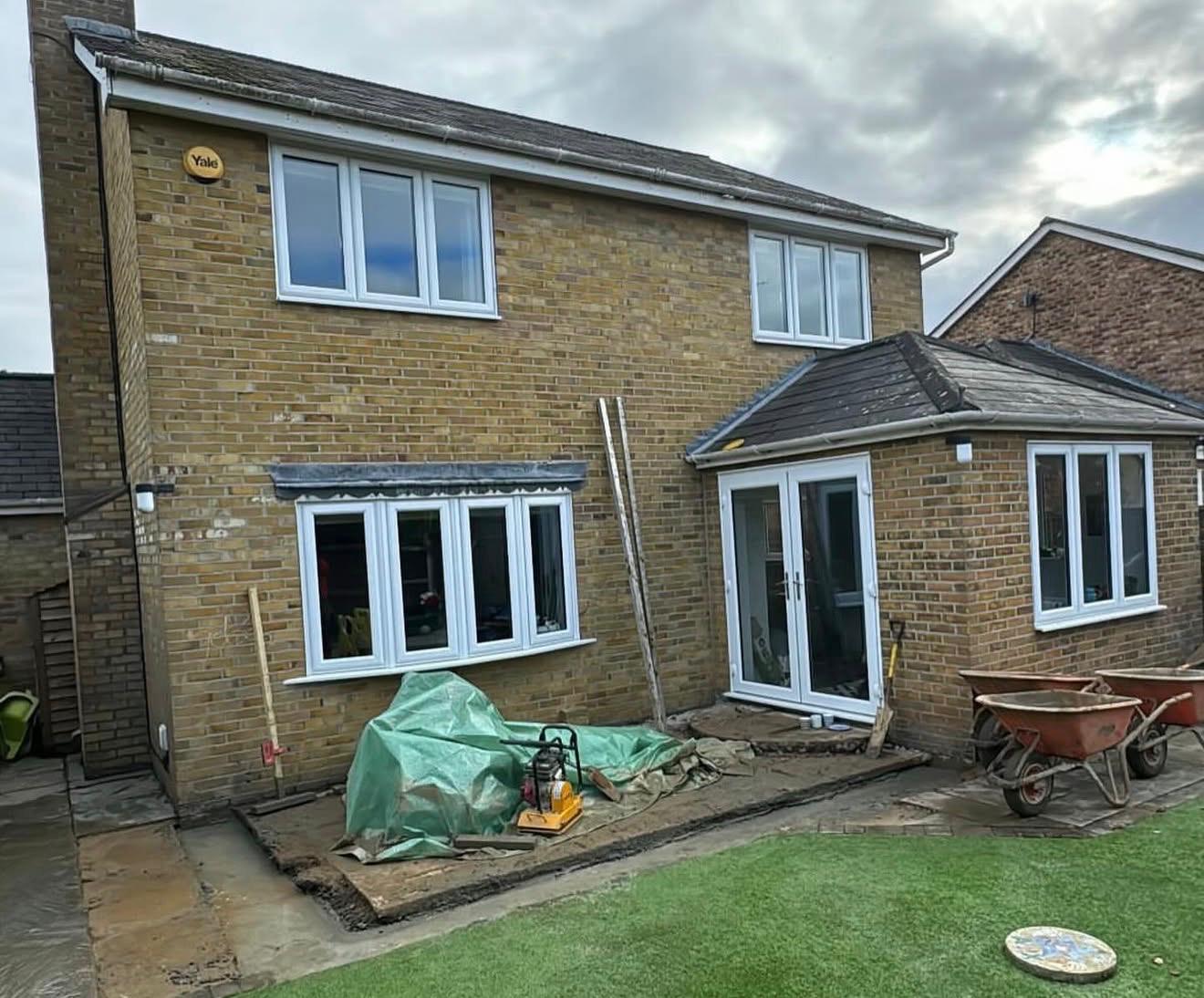 Side of a residential property prior to works, with access ladder in place