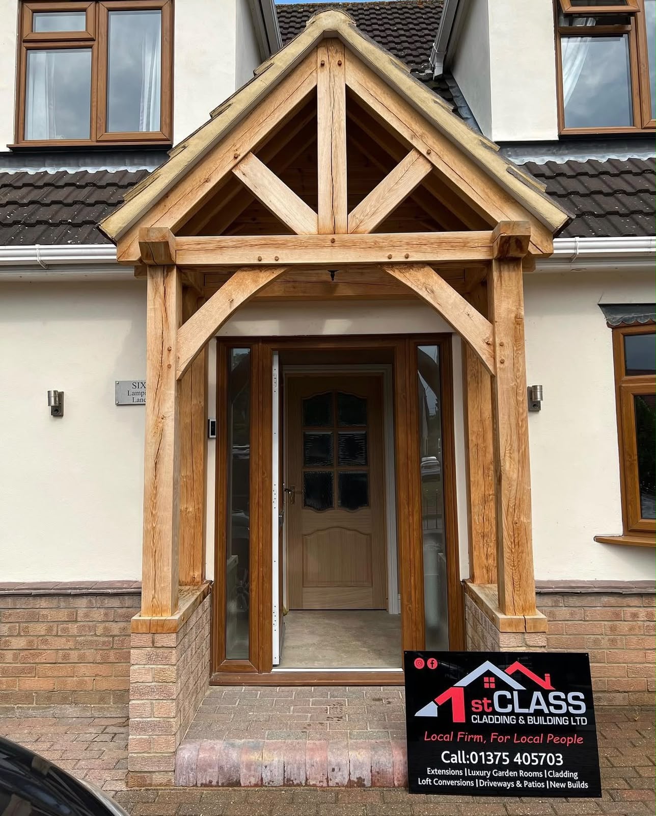 Bespoke green oak porch extension with pitched tiled roof